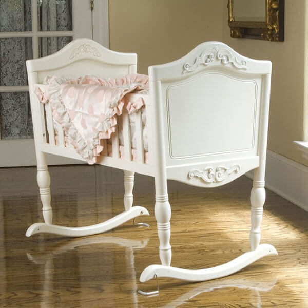 white wooden bassinet